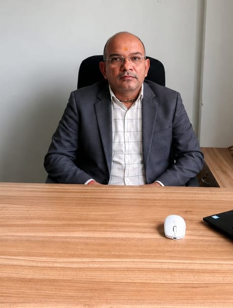Raghunath Siddh, founder of MATEK Interiors, at his desk in the studio office